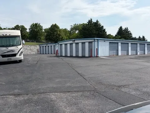 Class A motorhome parked in the paved RV and boat storage lot next to the storage buildings in Staunton, Virginia