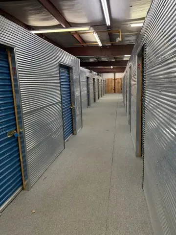Interior hallway between climate-controlled units, wide enough to move furniture and boxes on a dolly at American Mini Storage in Staunton, VA